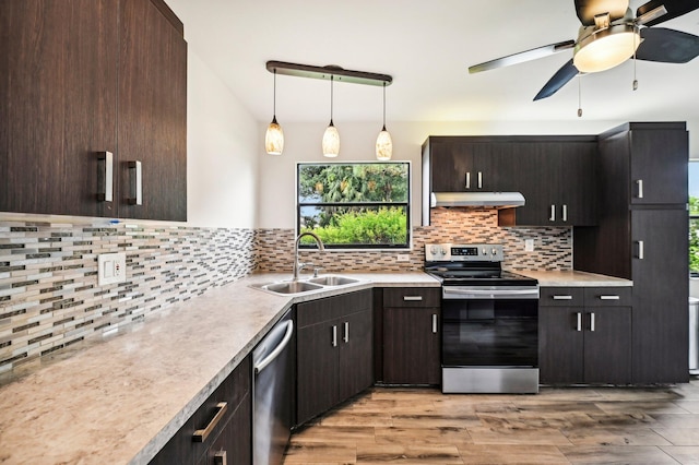 kitchen with light hardwood / wood-style flooring, stainless steel appliances, ceiling fan, and sink