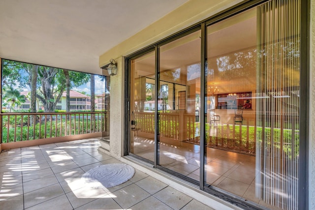 doorway with tile patterned floors