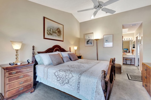 bedroom with lofted ceiling, ensuite bath, ceiling fan, and light colored carpet