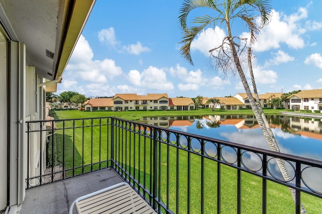 balcony featuring a water view