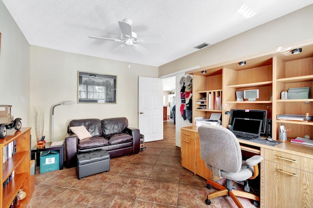 office area featuring a textured ceiling and ceiling fan