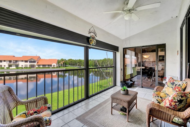 sunroom / solarium with ceiling fan, vaulted ceiling, and a water view