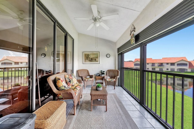 sunroom / solarium with ceiling fan, lofted ceiling, and plenty of natural light