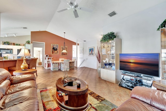 tiled living room with vaulted ceiling and ceiling fan