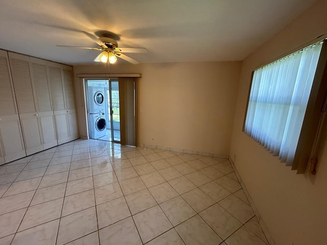 tiled living room featuring ceiling fan