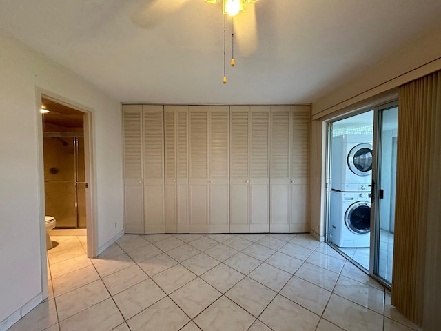 living room featuring light tile patterned flooring and ceiling fan