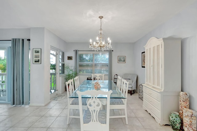 dining area with a healthy amount of sunlight, light tile patterned floors, and a chandelier