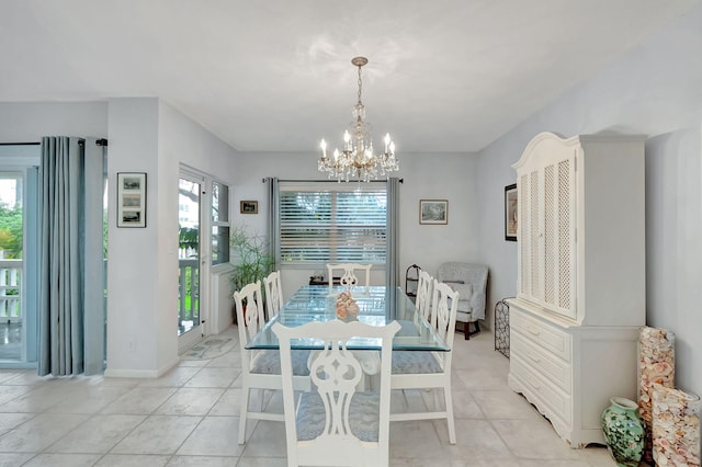 dining space with an inviting chandelier and light tile patterned flooring