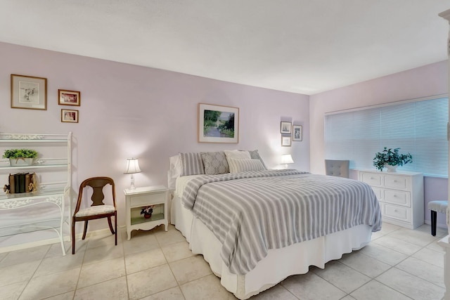 bedroom with light tile patterned flooring