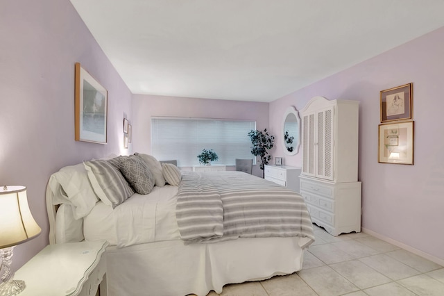 bedroom with light tile patterned flooring