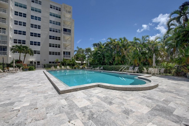 view of swimming pool featuring a patio area