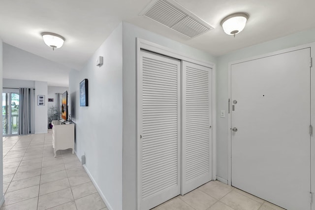 hallway with light tile patterned floors