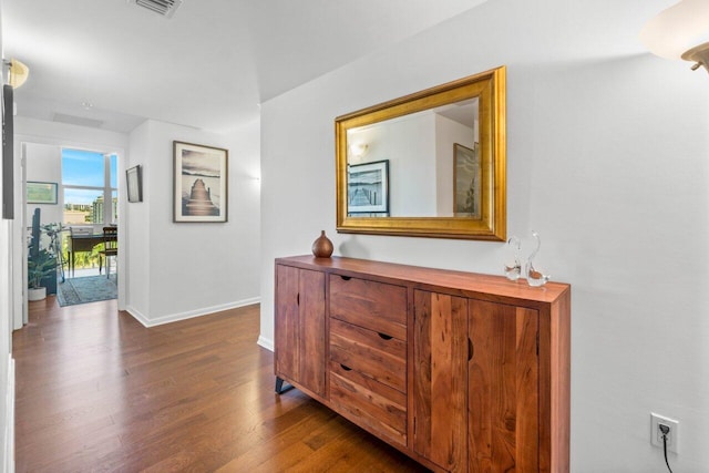 hall with dark hardwood / wood-style flooring