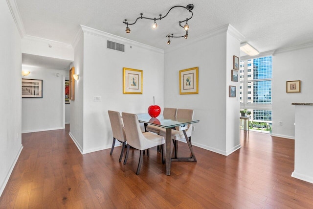 dining area with a healthy amount of sunlight, dark hardwood / wood-style floors, and crown molding