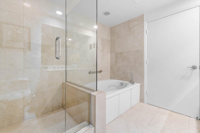 bathroom featuring plus walk in shower