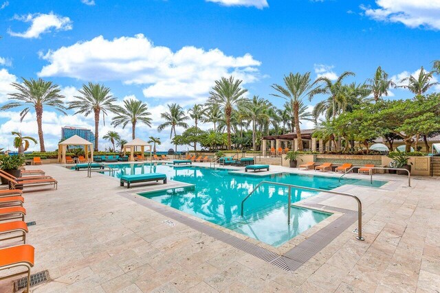 view of swimming pool featuring a gazebo and a patio