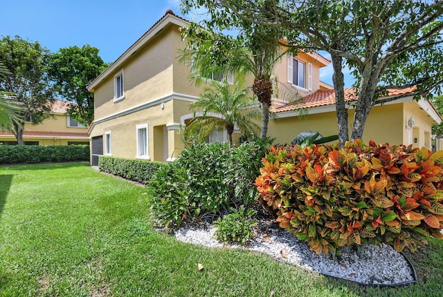 view of side of property featuring a yard