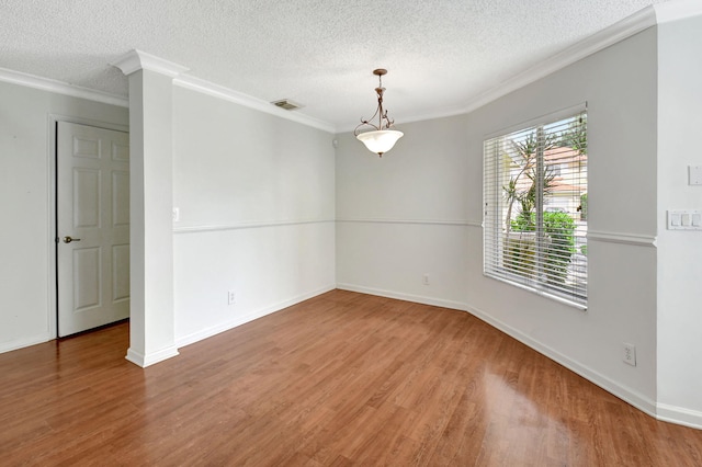 unfurnished room featuring a textured ceiling, crown molding, and hardwood / wood-style floors