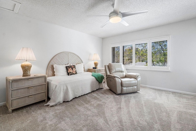 bedroom featuring ceiling fan, light carpet, and a textured ceiling