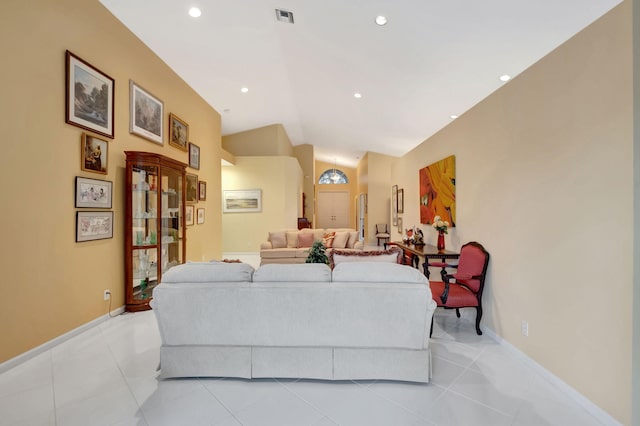 tiled living room with lofted ceiling