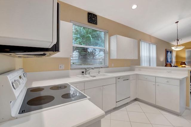 kitchen featuring kitchen peninsula, sink, white cabinets, and white appliances