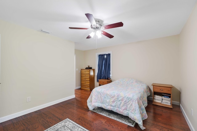 bedroom featuring ceiling fan and dark hardwood / wood-style flooring