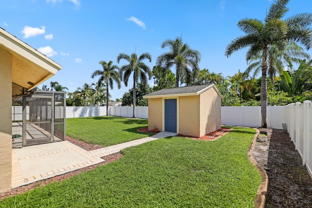 view of yard with a patio area and a shed