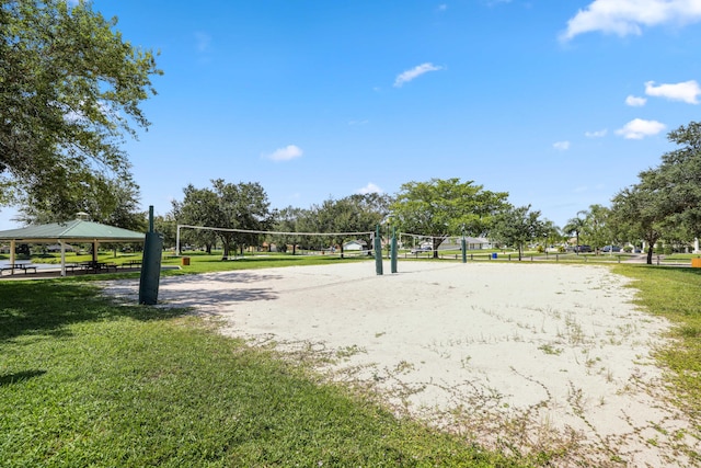 view of property's community featuring a gazebo, a yard, and volleyball court