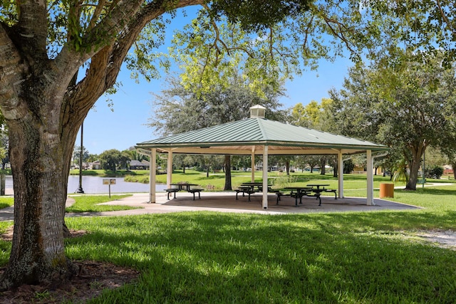 view of community featuring a gazebo, a yard, and a water view