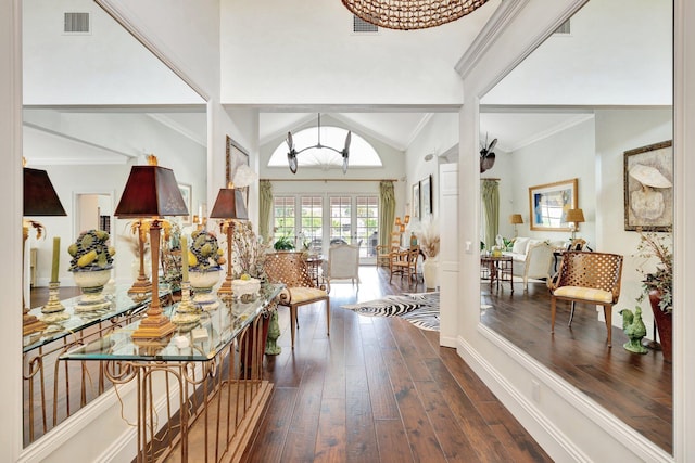 hallway featuring vaulted ceiling, crown molding, and dark hardwood / wood-style flooring