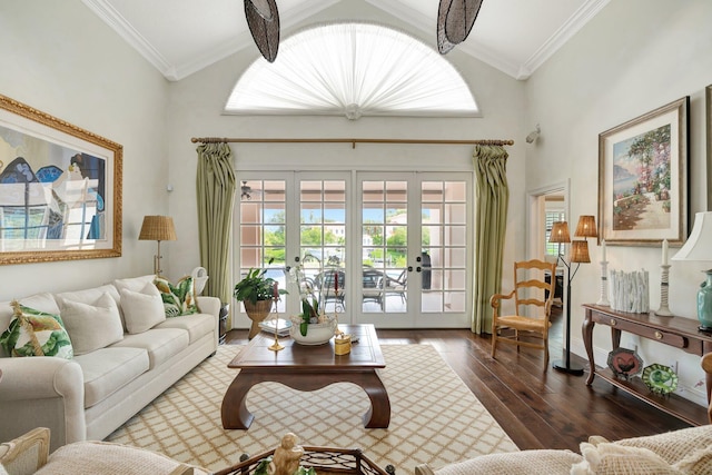 living room with ornamental molding, dark hardwood / wood-style flooring, french doors, and high vaulted ceiling