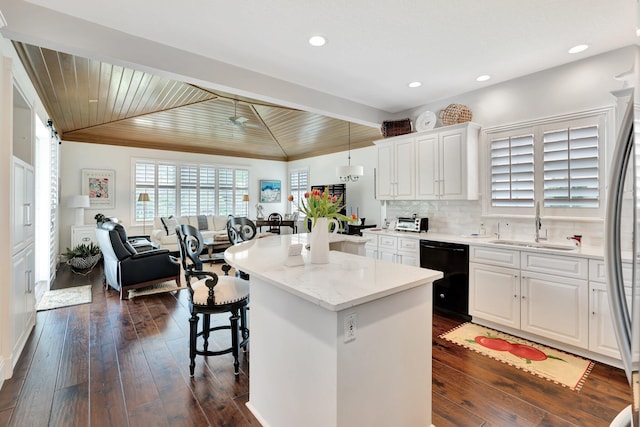 kitchen with ceiling fan, white cabinets, dishwasher, and dark wood-type flooring