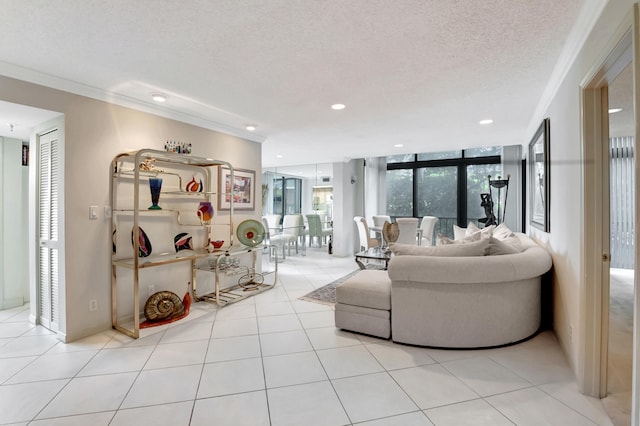 living room with ornamental molding, a textured ceiling, and light tile patterned floors