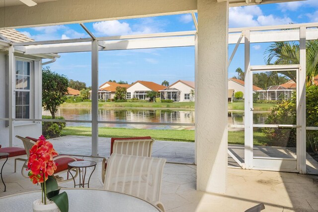 sunroom with a water view