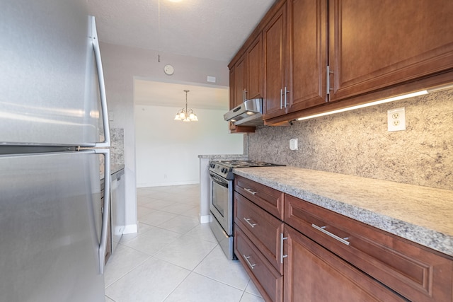 kitchen featuring light tile patterned floors, appliances with stainless steel finishes, tasteful backsplash, decorative light fixtures, and a chandelier