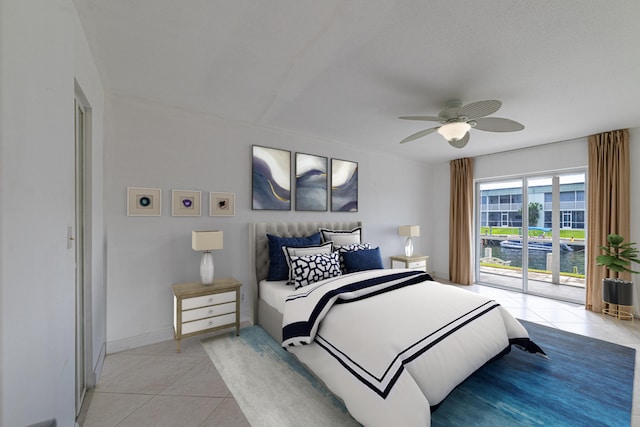 tiled bedroom with ceiling fan and access to exterior