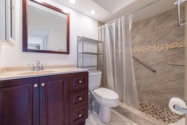 bathroom featuring toilet, tile patterned flooring, a shower with curtain, and vanity