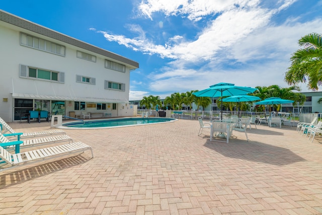 view of swimming pool featuring a patio