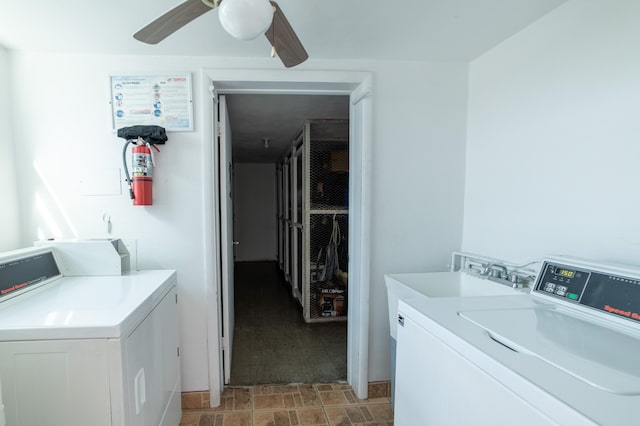 clothes washing area featuring ceiling fan, sink, and washing machine and clothes dryer