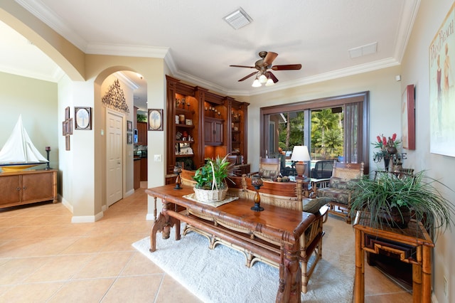 interior space featuring arched walkways, visible vents, crown molding, and light tile patterned floors