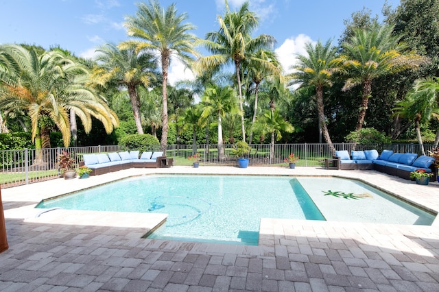 view of swimming pool with a patio, outdoor lounge area, a fenced backyard, and a fenced in pool