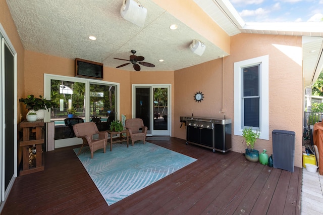 wooden terrace with ceiling fan