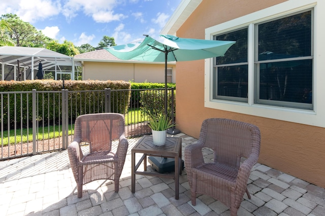 view of patio featuring fence