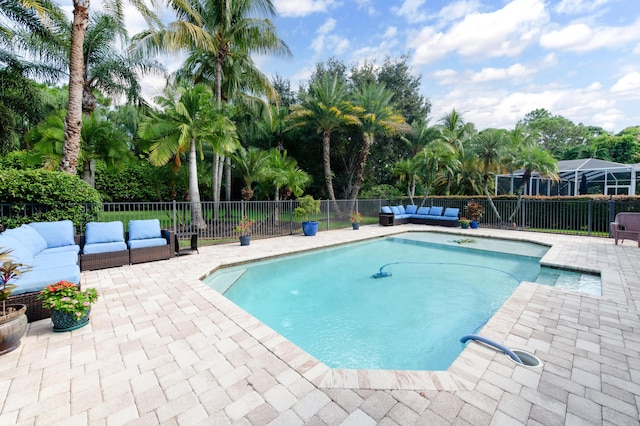 view of swimming pool featuring a fenced in pool, a fenced backyard, a patio, and an outdoor hangout area