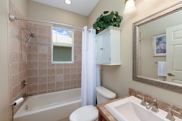 bathroom with shower / tub combo with curtain, vanity, and toilet