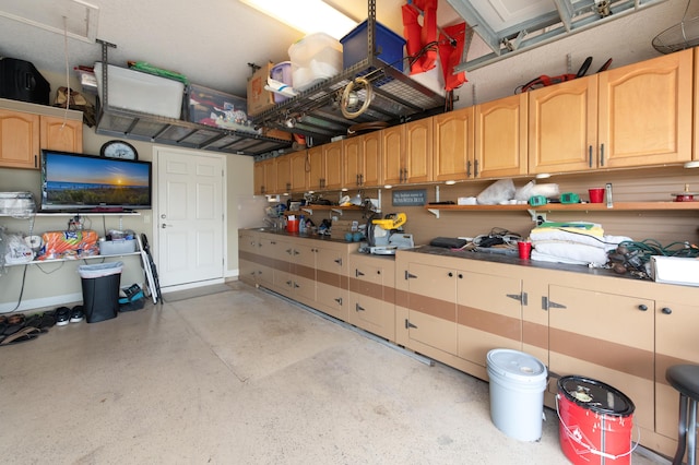 garage featuring baseboards