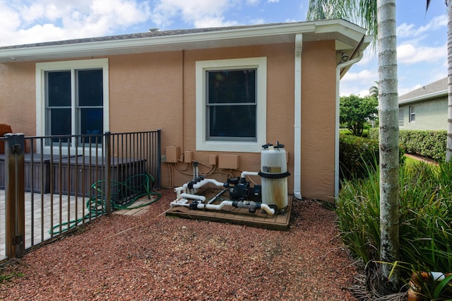 view of side of property featuring a patio and stucco siding