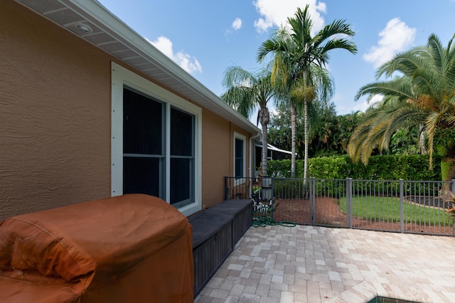 view of patio featuring fence