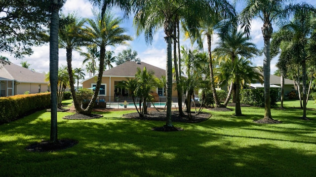 view of yard featuring an outdoor pool