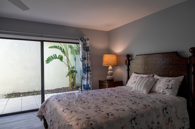 bedroom with access to outside, light hardwood / wood-style flooring, and ceiling fan